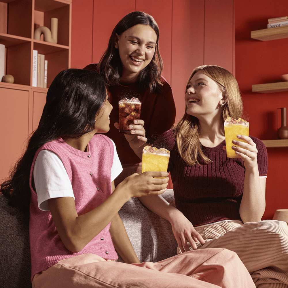 Friends enjoying Sodastream drinks, including the Sodastream Xtreme Energy